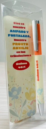Un bolígrafo naranja envuelto en plástico y una tarjeta decorativa con el texto del Salmo 46:1, que describe a Dios como nuestra fortaleza y nuestro amparo.
