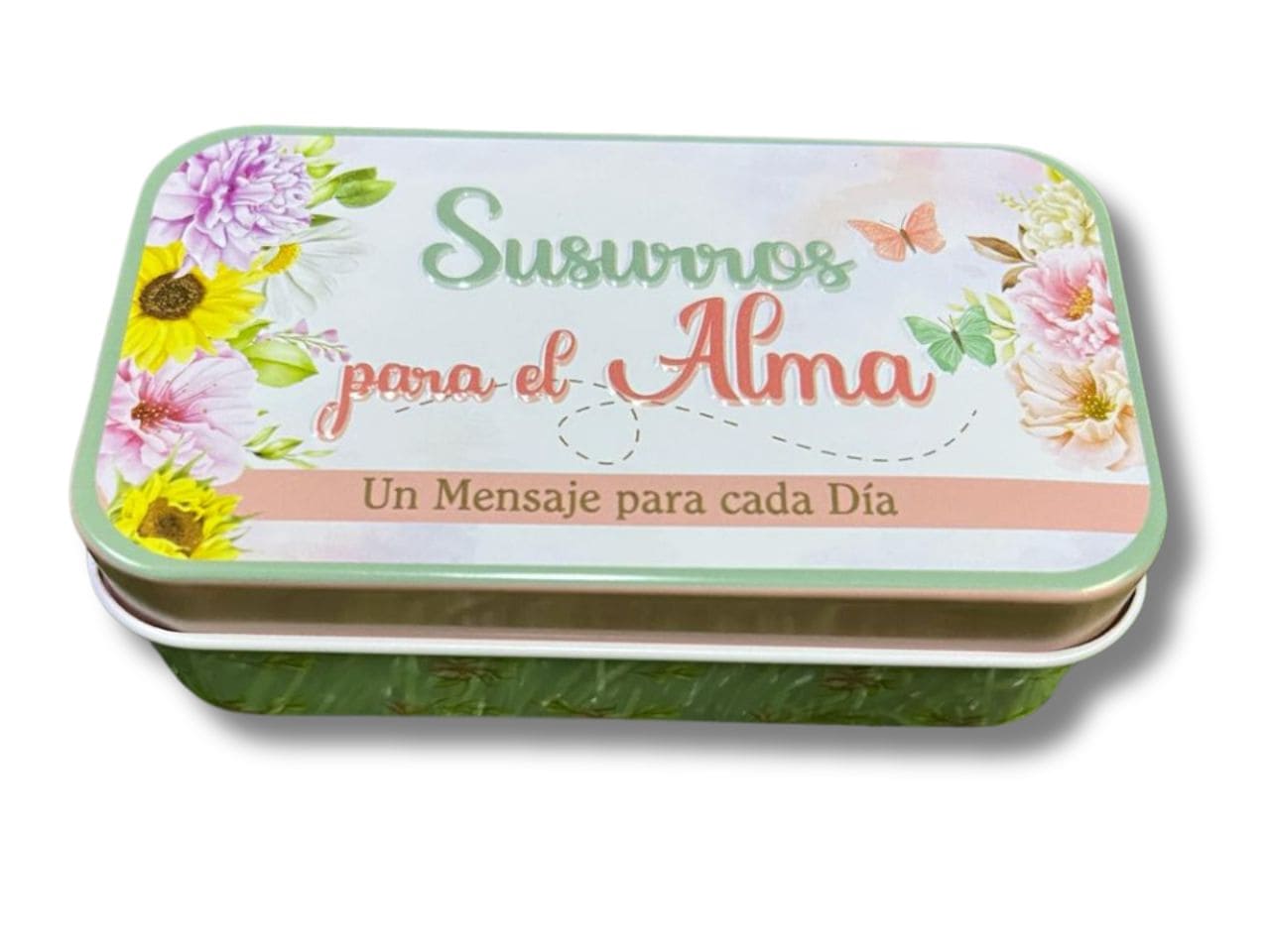 Una caja metálica rectangular con motivos florales y un texto en español que reza «Susurros para el alma, un mensaje para cada día» contiene tarjetas cristianas con versículos bíblicos inspiradores para cada ocasión.