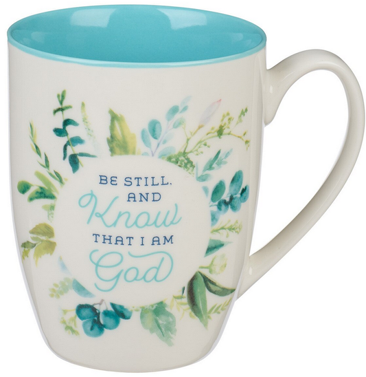 Una taza de cerámica de 12 fl oz con el interior azul, decorada con hojas verdes y el texto «Be still and know that I am God» en el exterior. Apto para el lavavajillas y el microondas, para mayor comodidad en el día a día.