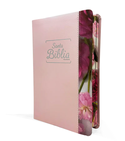 Una Biblia en español con la cubierta rosa, en la que se lee «Santa Biblia» en la portada, con motivos florales a lo largo del borde del libro y «promesas bíblicas» resaltadas en el interior.