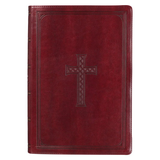 Un libro de gran formato, de tapa dura, de la Versión del Rey Jacobo con letra grande, con una cubierta de cuero rojo que presenta un diseño de cruz en relieve en el centro y prácticas pestañas de índice para el pulgar.