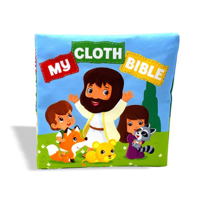 Un colorido libro de tela titulado «Mi Biblia de tela» muestra a niños ilustrados, a un hombre barbudo con túnicas blancas y a animales en un prado verde; es perfecto como libro lavable y seguro para los niños, e ideal como primera Biblia para los bebés.