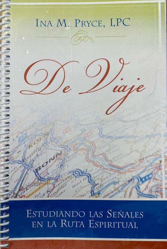 Portada de un libro con encuadernación en espiral titulado *De Viaje*, de Ina M. Pryce, LPC, con un fondo de mapa y el subtítulo *Estudiando las señales en la ruta espiritual*, que explora las señales espirituales a lo largo de tu viaje.