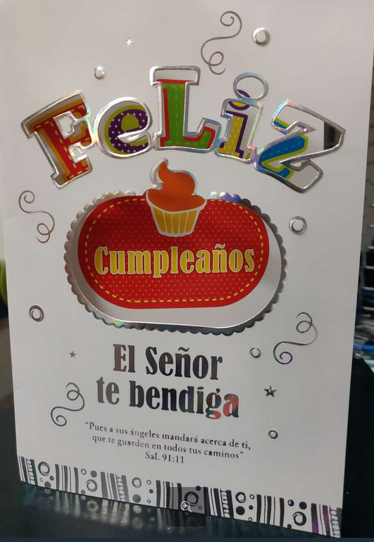 Tarjeta de felicitación con la frase «Feliz Cumpleaños» en letras de colores, una ilustración de una magdalena y el mensaje «El Señor te bendiga», con el Salmo 91:11 debajo: una preciosa tarjeta cristiana para celebrar y compartir bendiciones.