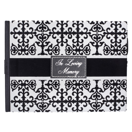 Un libro de visitas conmemorativo en blanco y negro con un motivo decorativo y una etiqueta en la portada en la que se lee «In Loving Memory».