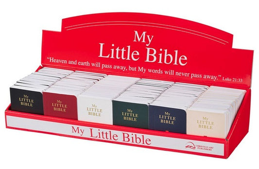 Una caja expositora que contiene varios folletos pequeños titulados «My Little Bible» en distintos colores, con un letrero rojo en el que se cita Lucas 21:33; cada folleto es un práctico guía de las Escrituras repleto de versículos bíblicos clave y sabiduría bíblica atemporal.