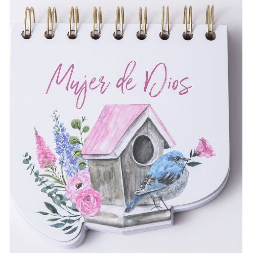 Una libreta con encuadernación en espiral y troquelada, en la que se lee «Mujer de Dios» sobre una ilustración de una casita para pájaros, flores y un pájaro azul que sostiene una flor rosa.
