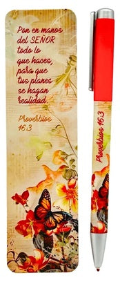 Un marcapáginas con motivos florales en el que figura Proverbios 16:3 y un bolígrafo rojo a juego con la cita bíblica sobre encomendar tus planes al Señor.
