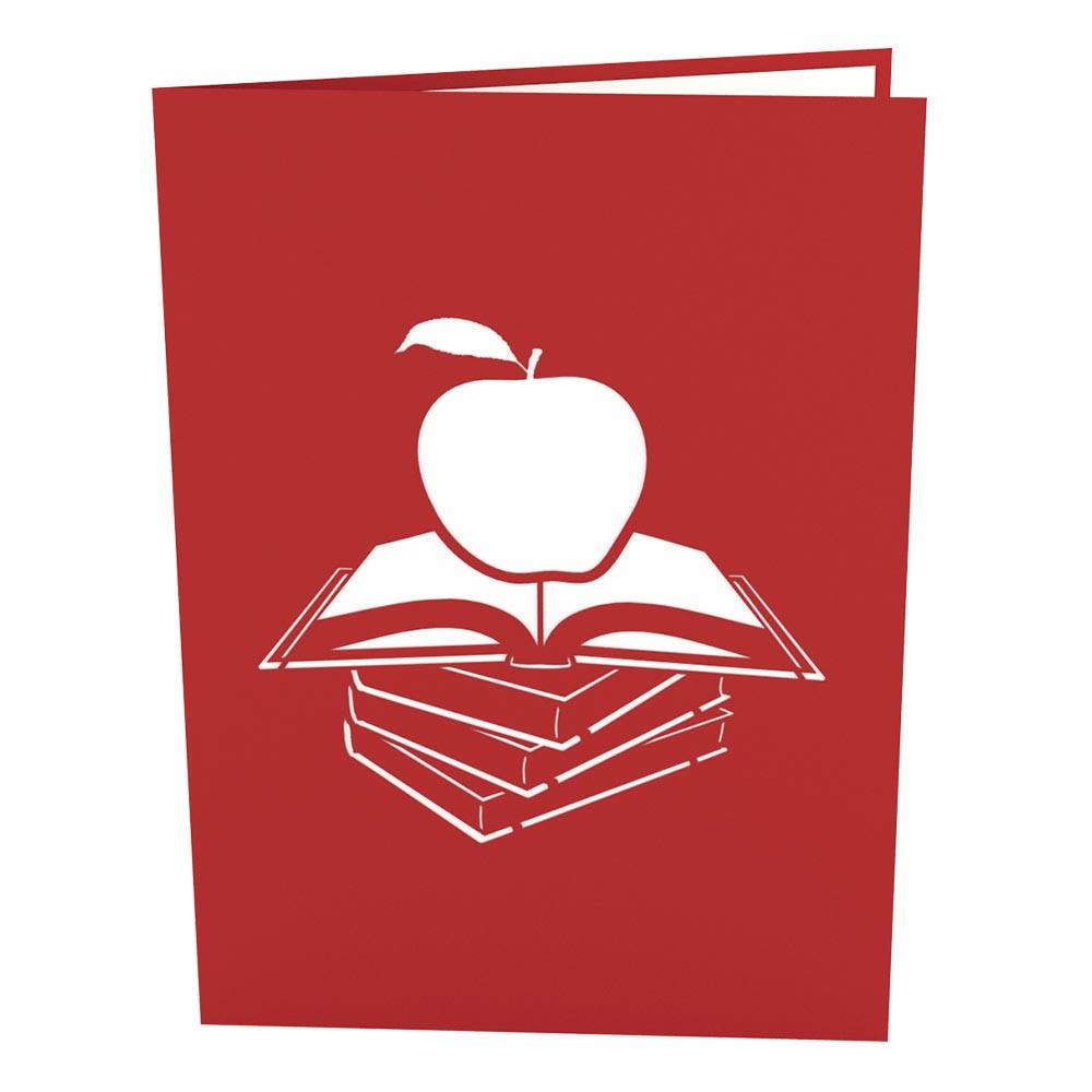 Una tarjeta de 5 x 7 de color rojo, con la silueta blanca de una manzana sobre un libro abierto y tres libros cerrados apilados debajo, ideal como tarjeta de alta calidad para cualquier ocasión.
