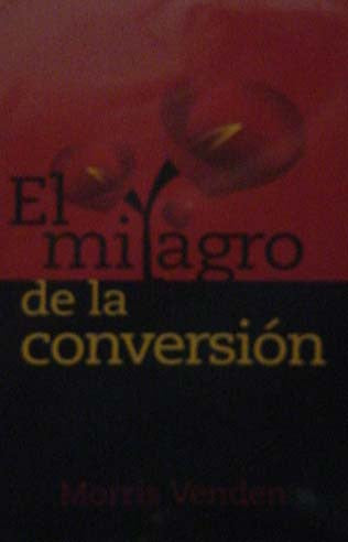 Portada del libro titulado *El milagro de la conversión*, de Morris Venden, en la que aparecen flores rojas sobre un fondo rojo y negro, y que destaca los temas de la conversión y el poder transformador del Espíritu Santo.