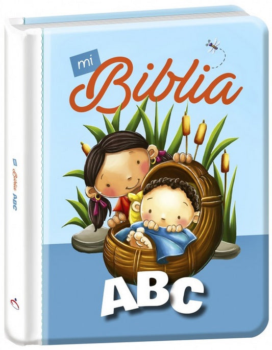 La portada del libro infantil titulado «Mi Biblia ABC» muestra una ilustración de una niña y un bebé en una cesta rodeados de plantas, con un fondo azul claro; es perfecto como libro para niños para aprender el abecedario y la Biblia.