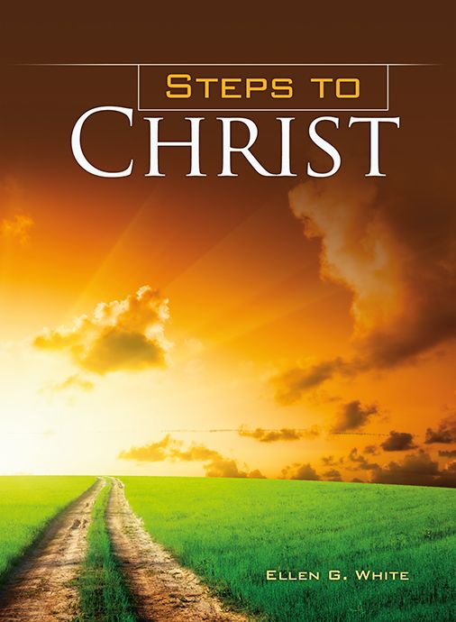 Portada del inspirador libro *Pasos hacia Cristo*, de Ellen G. White, una edición cristiana en rústica en la que se ve un camino de tierra que atraviesa un prado verde bajo un espectacular cielo amarillo anaranjado con nubes.