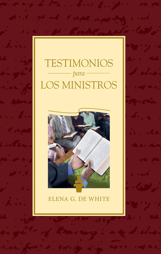 Portada de un libro en español titulado «Testimonios para los Ministros», de Elena G. de White, en la que aparece una fotografía de personas leyendo libros abiertos en una reunión, ideal para quienes buscan formación cristiana y renovación espiritual.