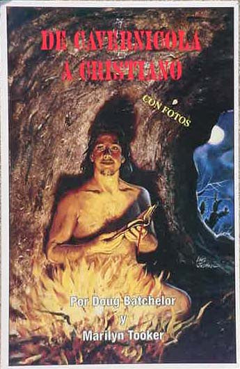 La portada del libro muestra a un hombre junto a una hoguera en una cueva, sosteniendo un palo. *De Cavernícola a Cristiano*, de Doug Batchelor y Marilyn Tooker, narra una poderosa historia de conversión e incluye fotografías.