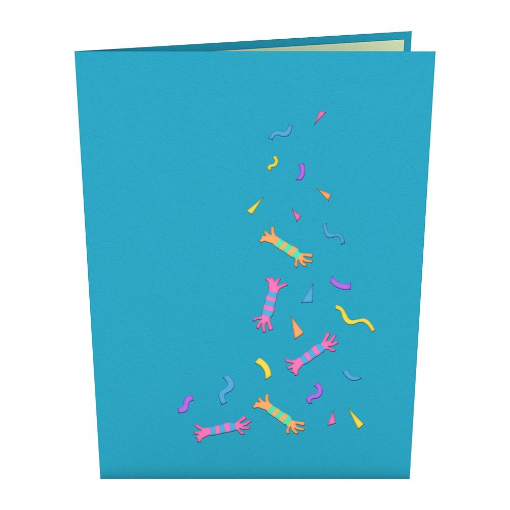 Una tarjeta azul de 5 x 7 pulgadas con coloridos petardos de fiesta y confeti dispuestos en forma de árbol de Navidad. Tarjeta de alta calidad, perfecta para aportar un toque festivo a cualquier celebración.