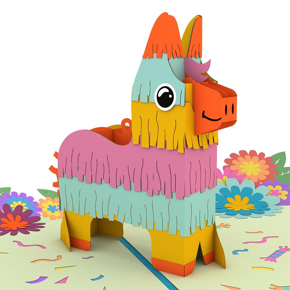 Una colorida tarjeta pop-up de alta calidad en la que aparece una piñata sonriente con forma de burro y flecos en tonos pastel, rodeada de flores de papel y motivos de confeti. ¡Perfecta como tarjeta festiva de 5 x 7 pulgadas para cualquier celebración!.