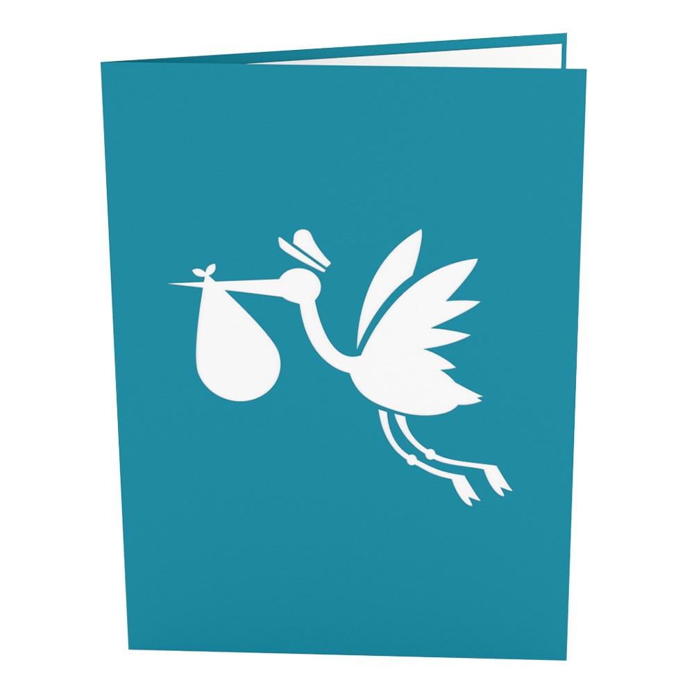 Una tarjeta de felicitación premium de color verde azulado con la silueta blanca de una cigüeña que lleva un pañalito en el pico, lo que simboliza la llegada de un bebé. Esta tarjeta de 5 x 7 es perfecta para celebrar los nuevos comienzos.