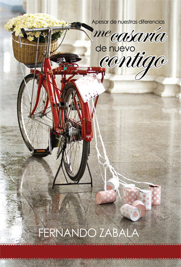 Una bicicleta roja con una cesta de flores y latas colgadas está aparcada en el interior, lo que simboliza un matrimonio feliz. El texto en español dice: «Me casaría de nuevo contigo» y «Fernando Zabala».