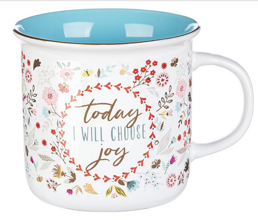 Taza de cerámica blanca con el interior azul, decorada con motivos florales de colores y con la frase «Hoy ELEGIRÉ la alegría» en el centro. Apta tanto para el microondas como para el lavavajillas, para mayor comodidad en el día a día.